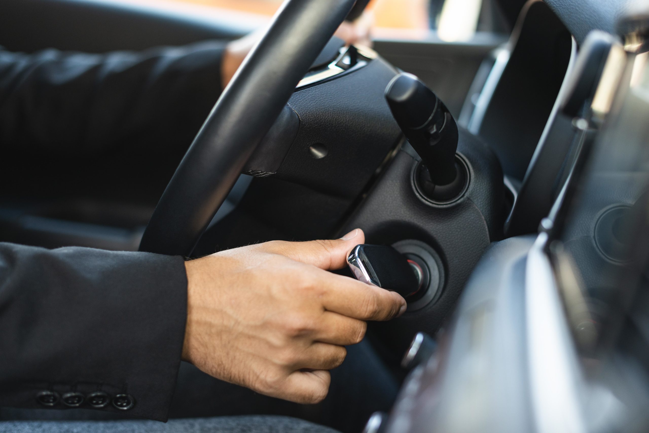 side-view-business-man-starting-car